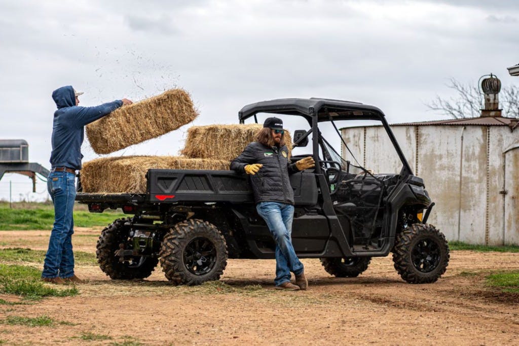 2025 can-am defender pro being loaded with hay bales