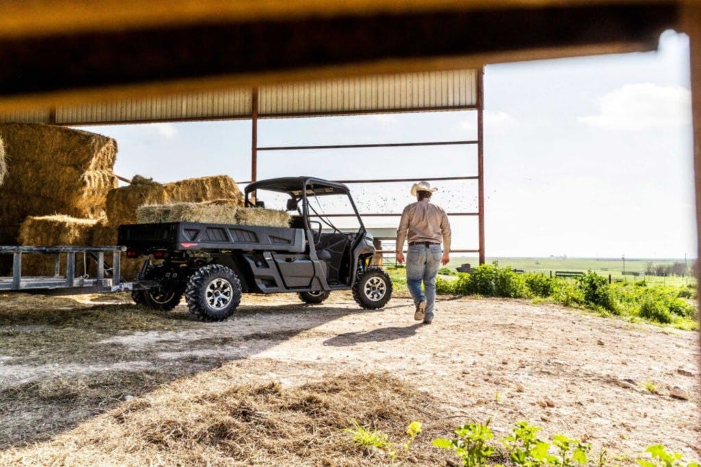 2025 can-am defender pro parked in a hay barn