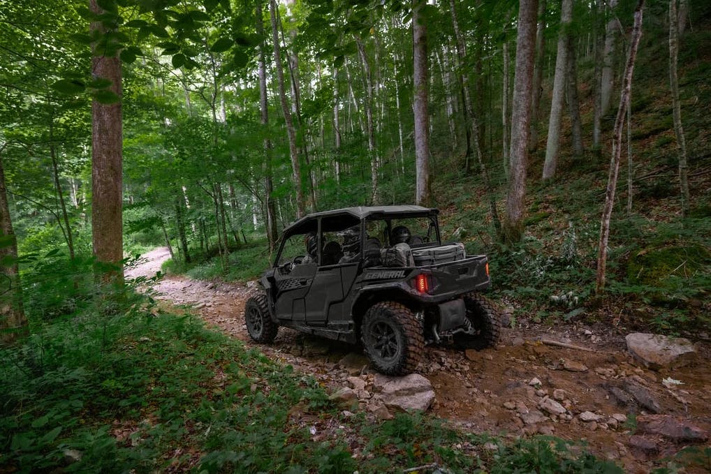 2024 polaris general xp 1000 four seater in the woods