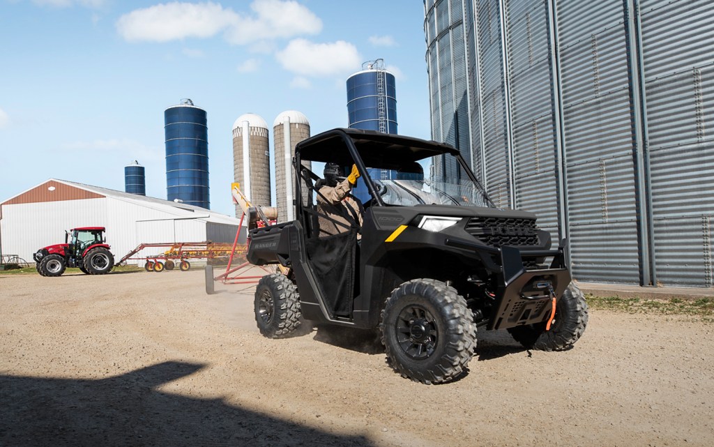 2024 Polaris Ranger Crew 1000 Premium doing work on a farm with tractor