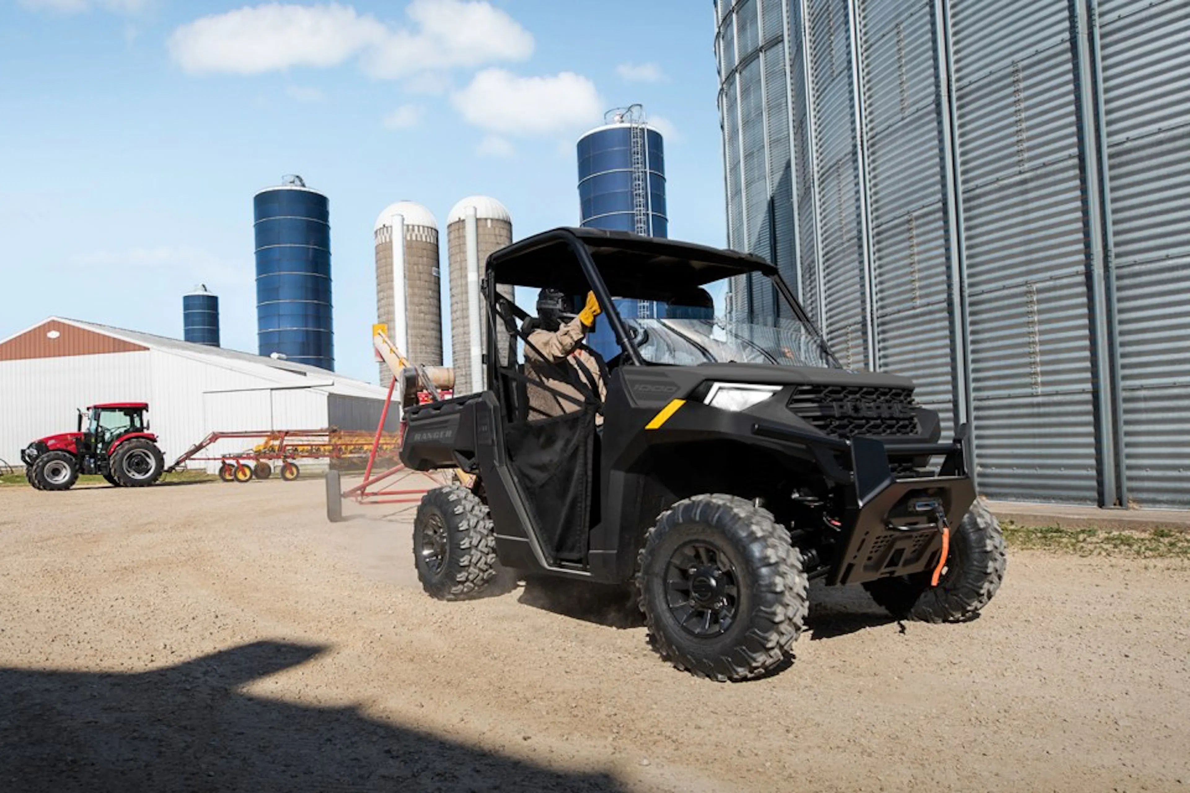 2024 Polaris Ranger Crew 1000 Premium doing work on a farm with tractor