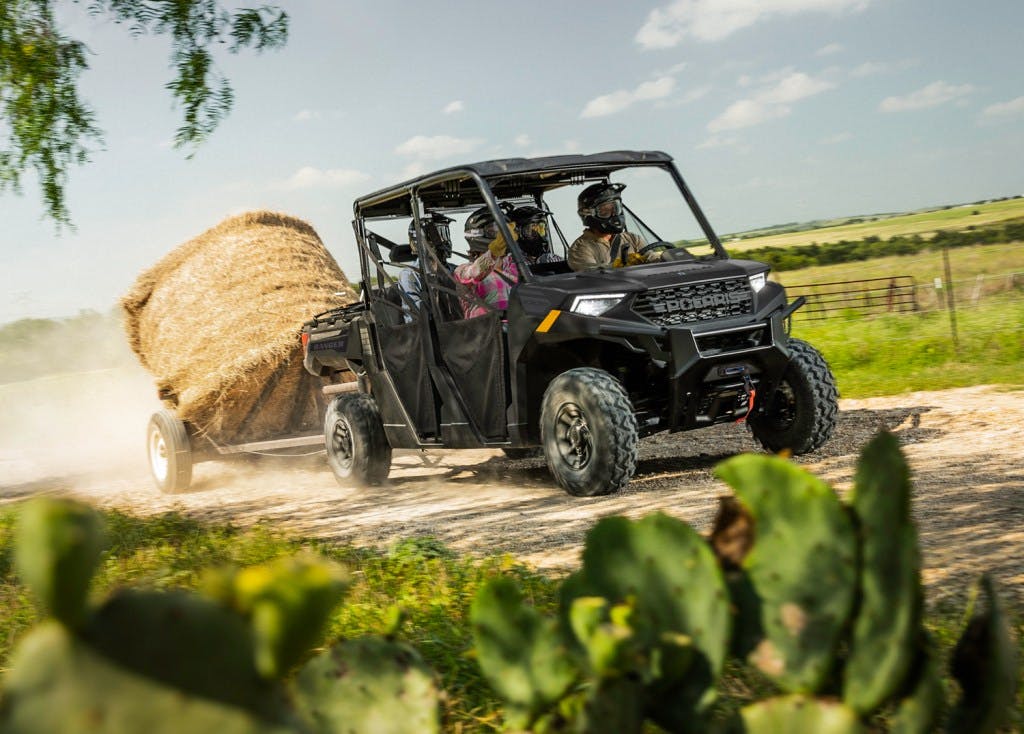 2024 Polaris Ranger Crew 1000 Premium towing on a farm hay fields crops