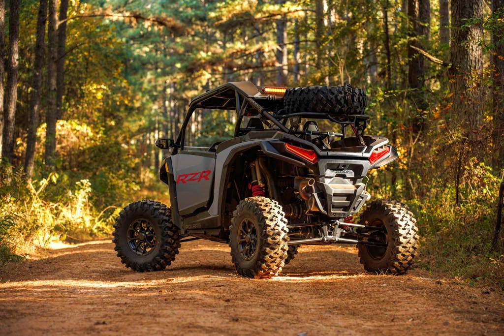2025 Polaris RZR XP Premium rear three-quarter engine woods dirt road