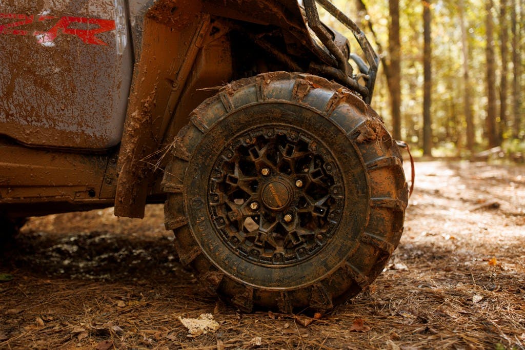 2025 Polaris RZR XP 4 Premium wheel in dirt tire
