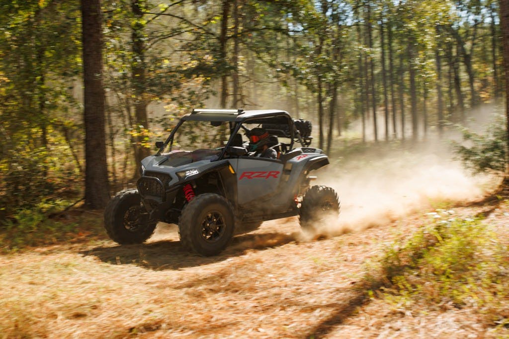 2025 Polaris RZR XP Premium dirt road accelerate trees