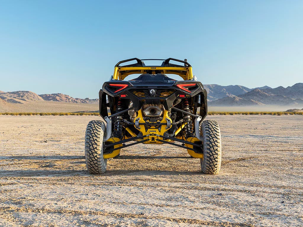 2025 Can-Am Maverick R from the rear in the desert.