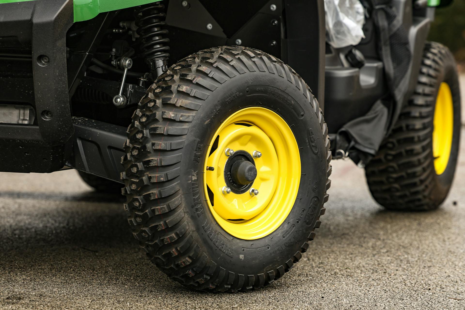 2025 John Deere Gator XUV560E driver front tire