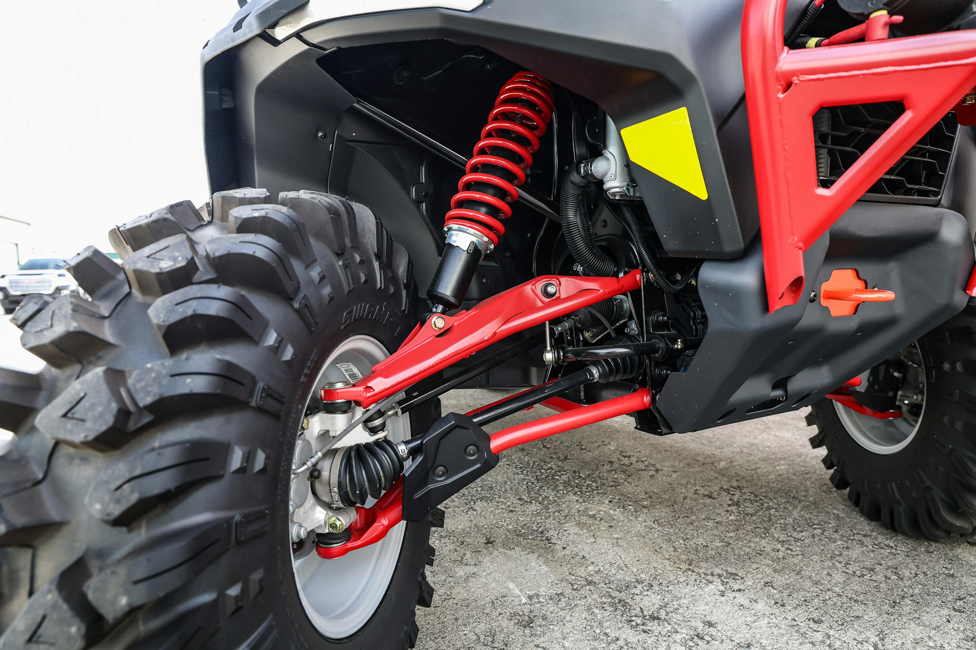 2024 Can-Am Defender HD10 XMR passenger front suspension detail 