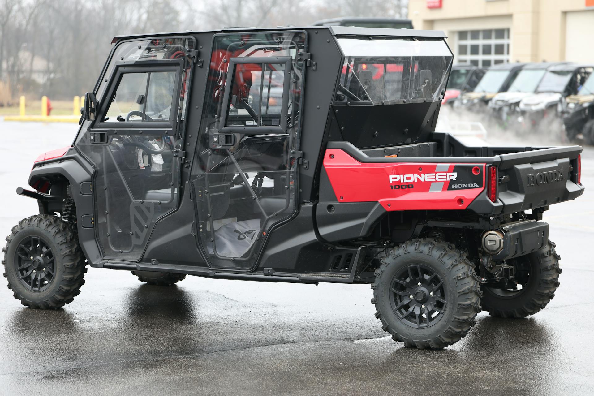 2024 Honda Pioneer 1000-6 DLX driver rear 3/4 wide