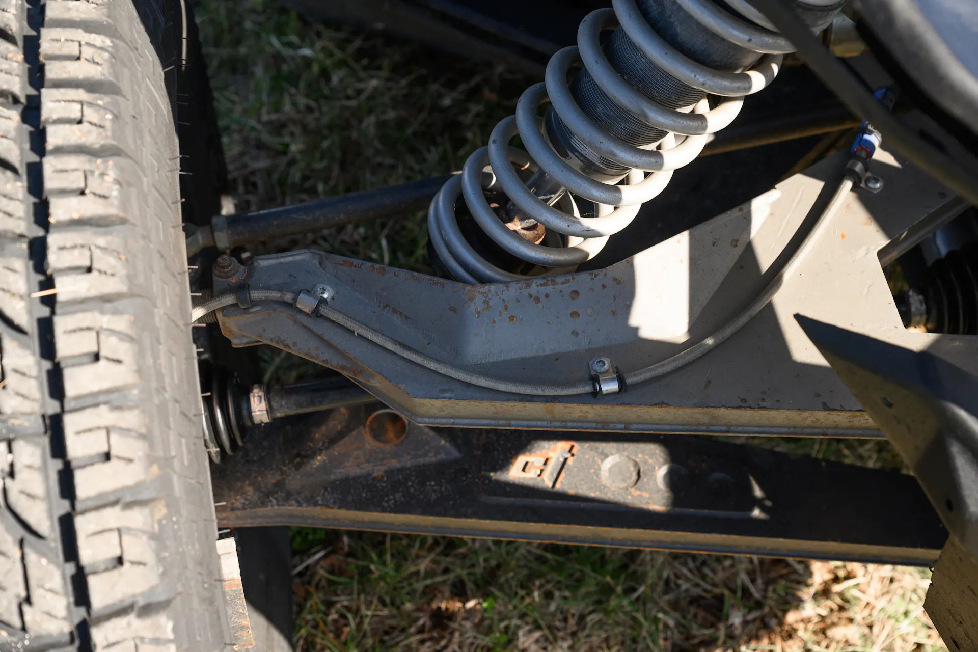 2024 Can-Am Maverick X3 Gray Leadbetter Race Car passenger A-arm detail