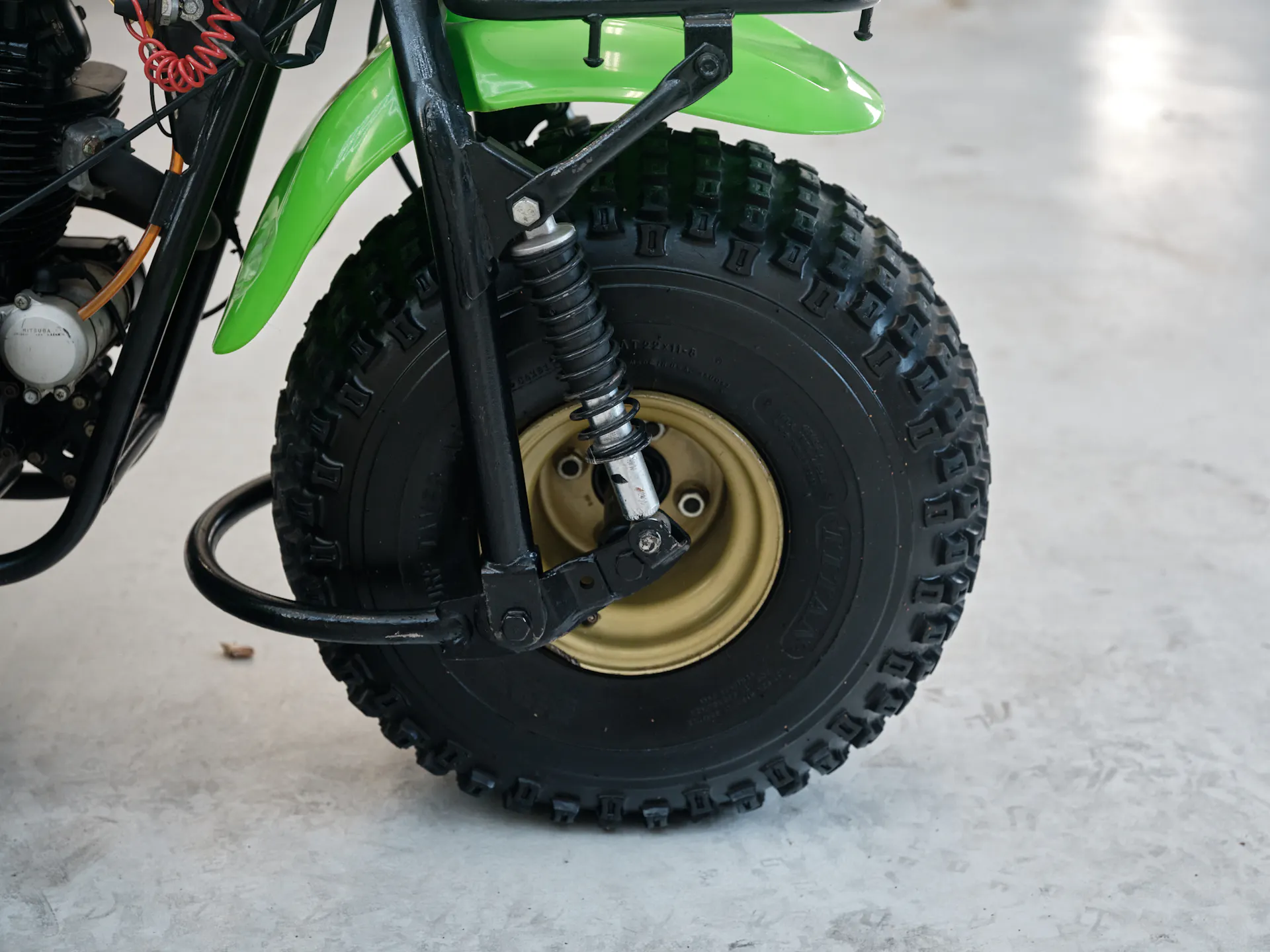 1985 Kawasaki KLT 250 front tire right side/shock 