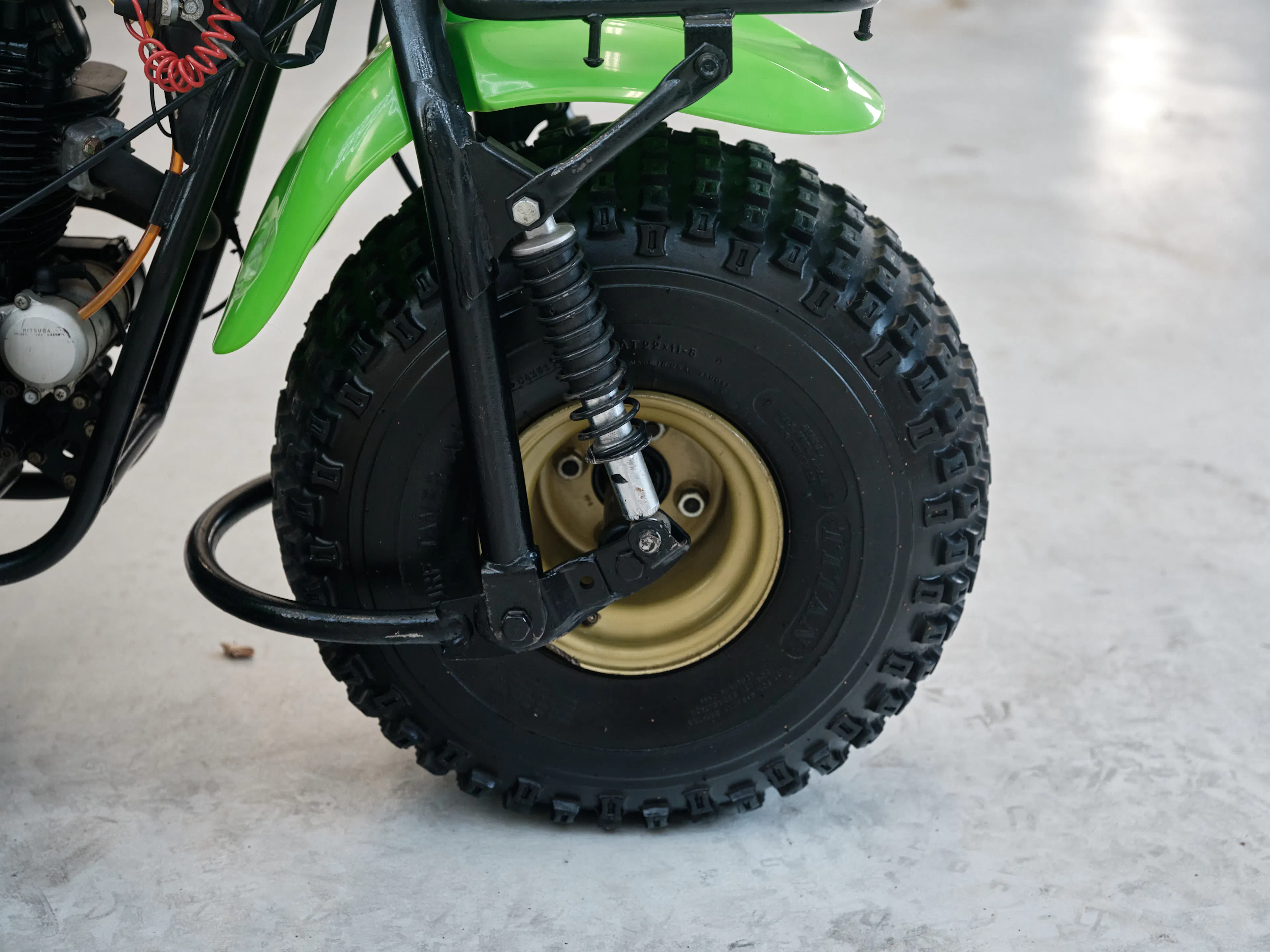 1985 Kawasaki KLT 250 front tire right side/shock 