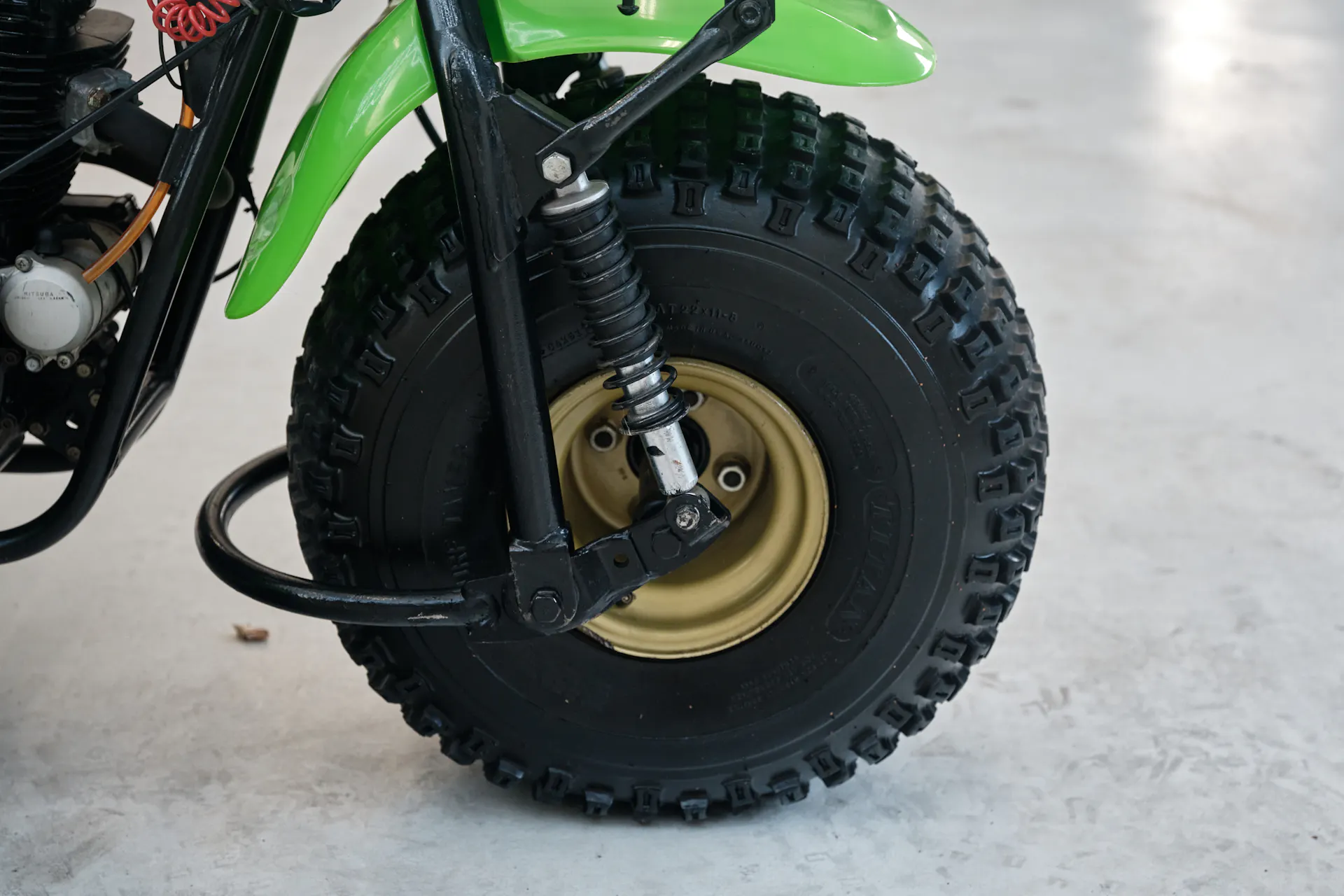 1985 Kawasaki KLT 250 front tire right side/shock