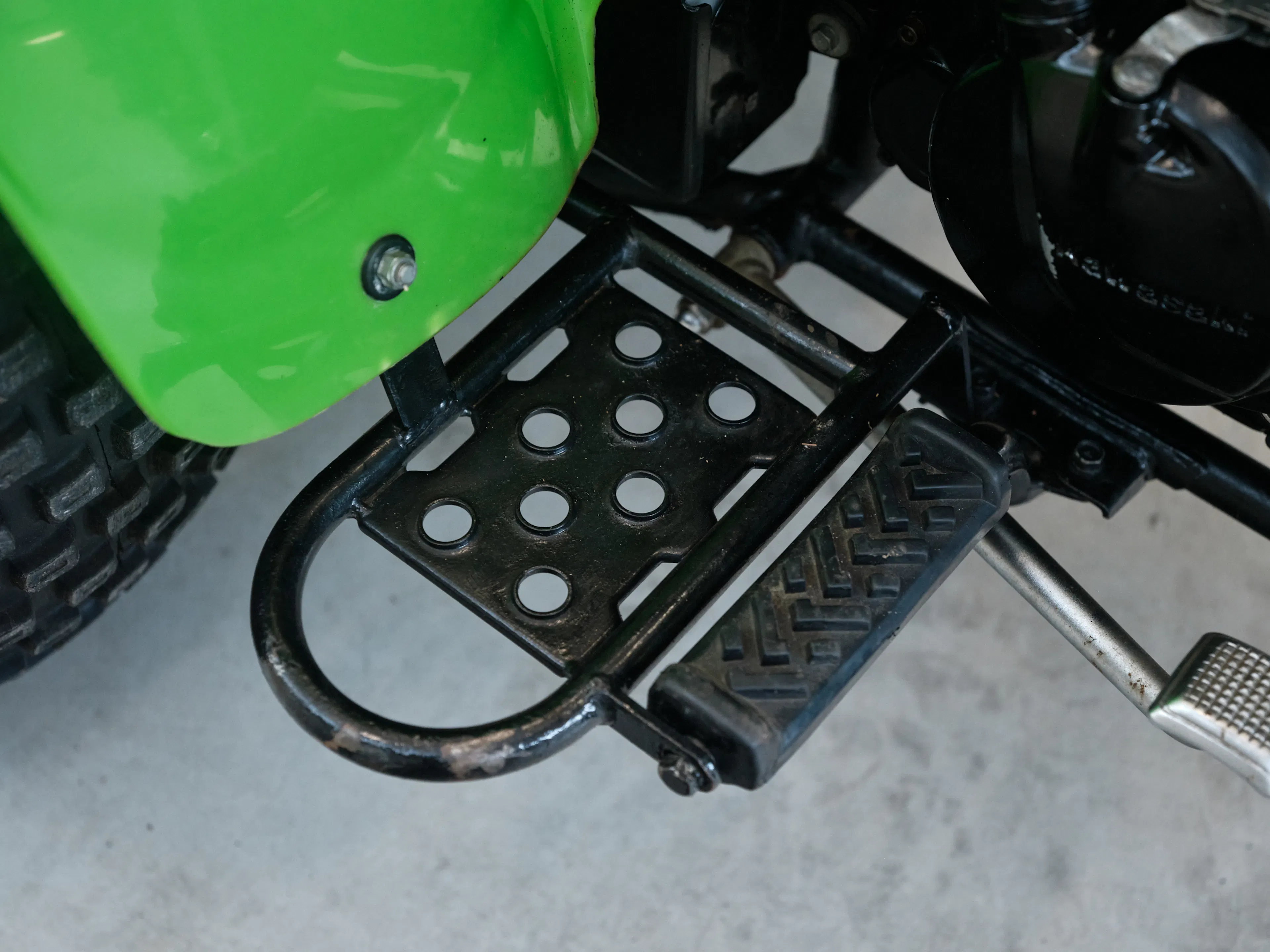 1985 Kawasaki KLT 250 right floorboard