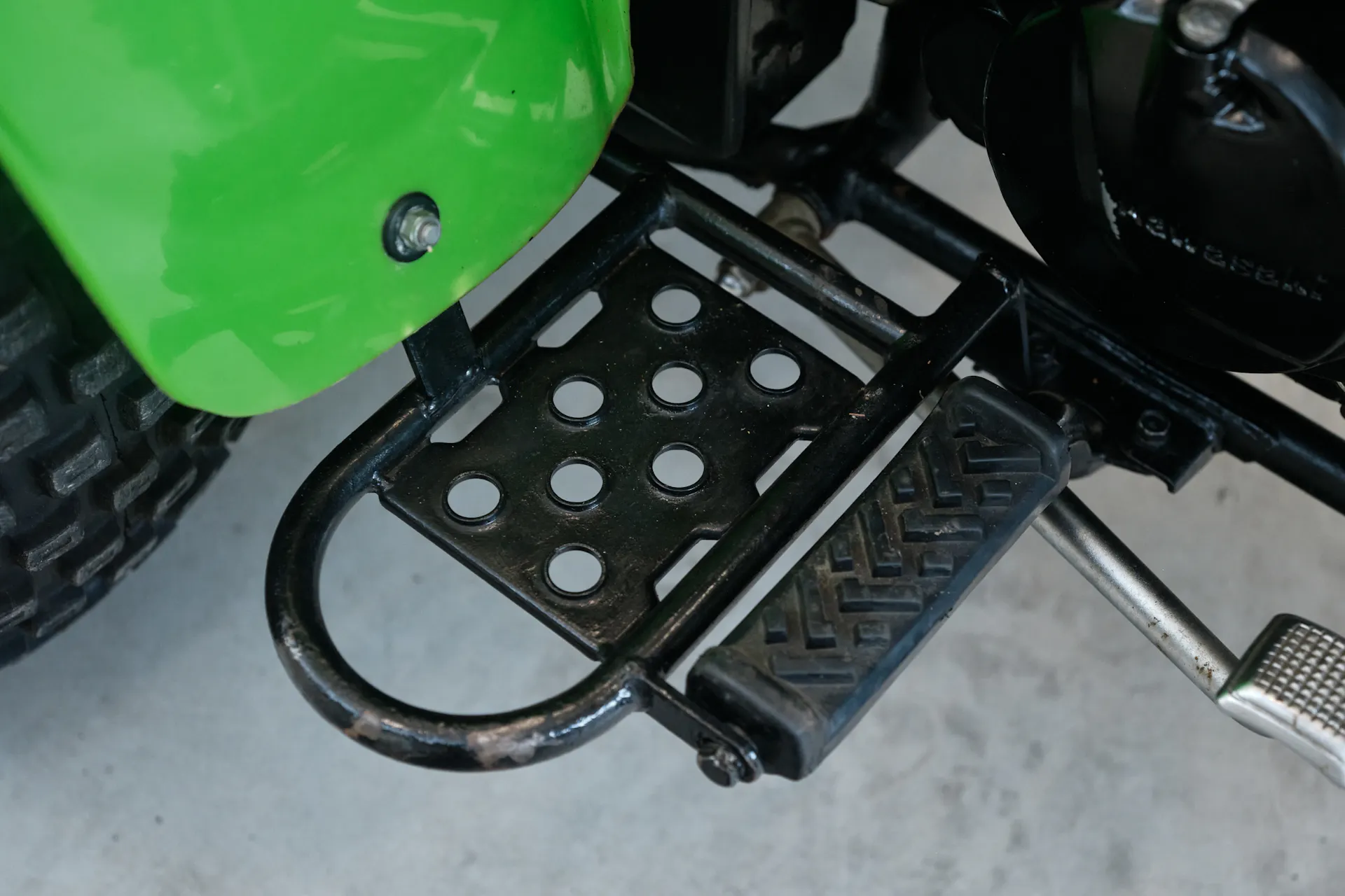 1985 Kawasaki KLT 250 right floorboard