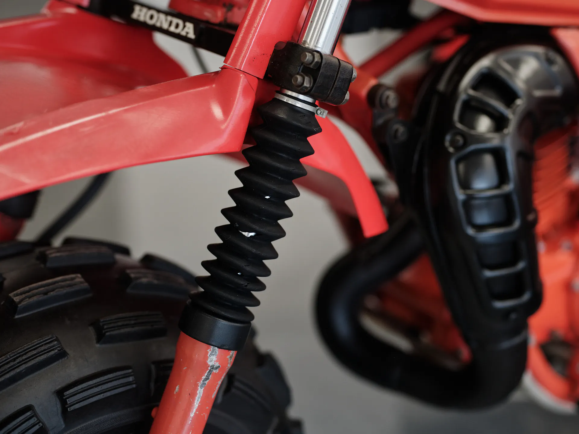 1982 Honda ATC 250R expansion chamber/fork gaiter detail