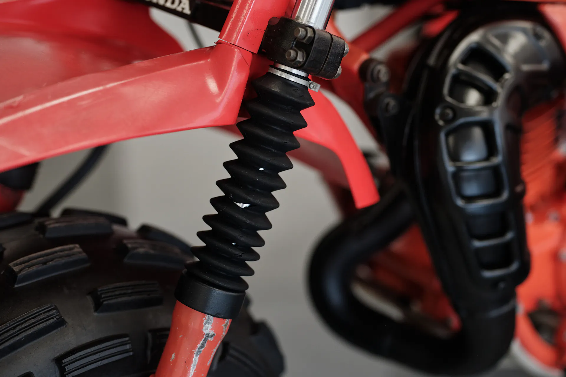 1982 Honda ATC 250R expansion chamber/fork gaiter detail