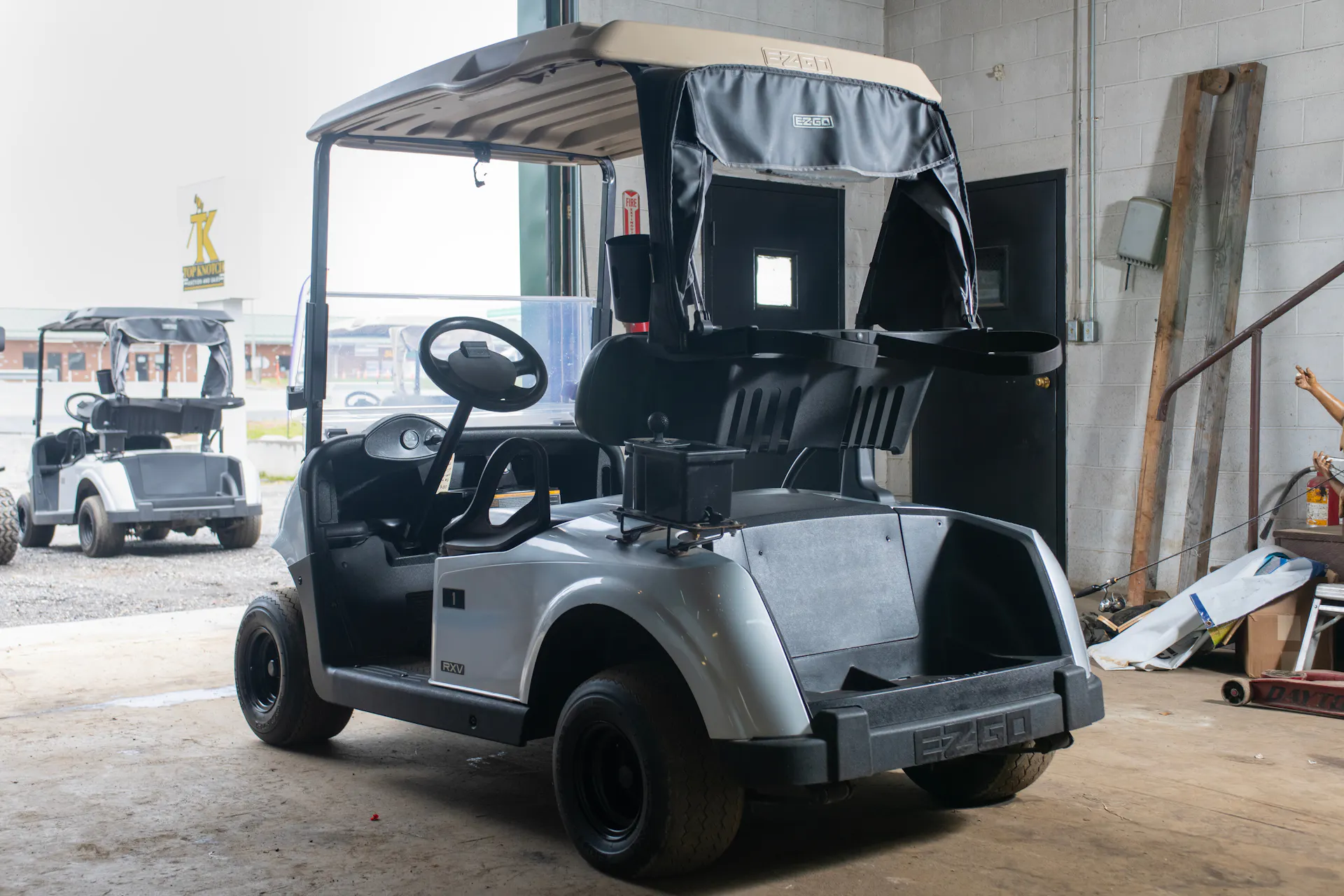 2020 E-Z-Go RXV Silver driver rear 3/4