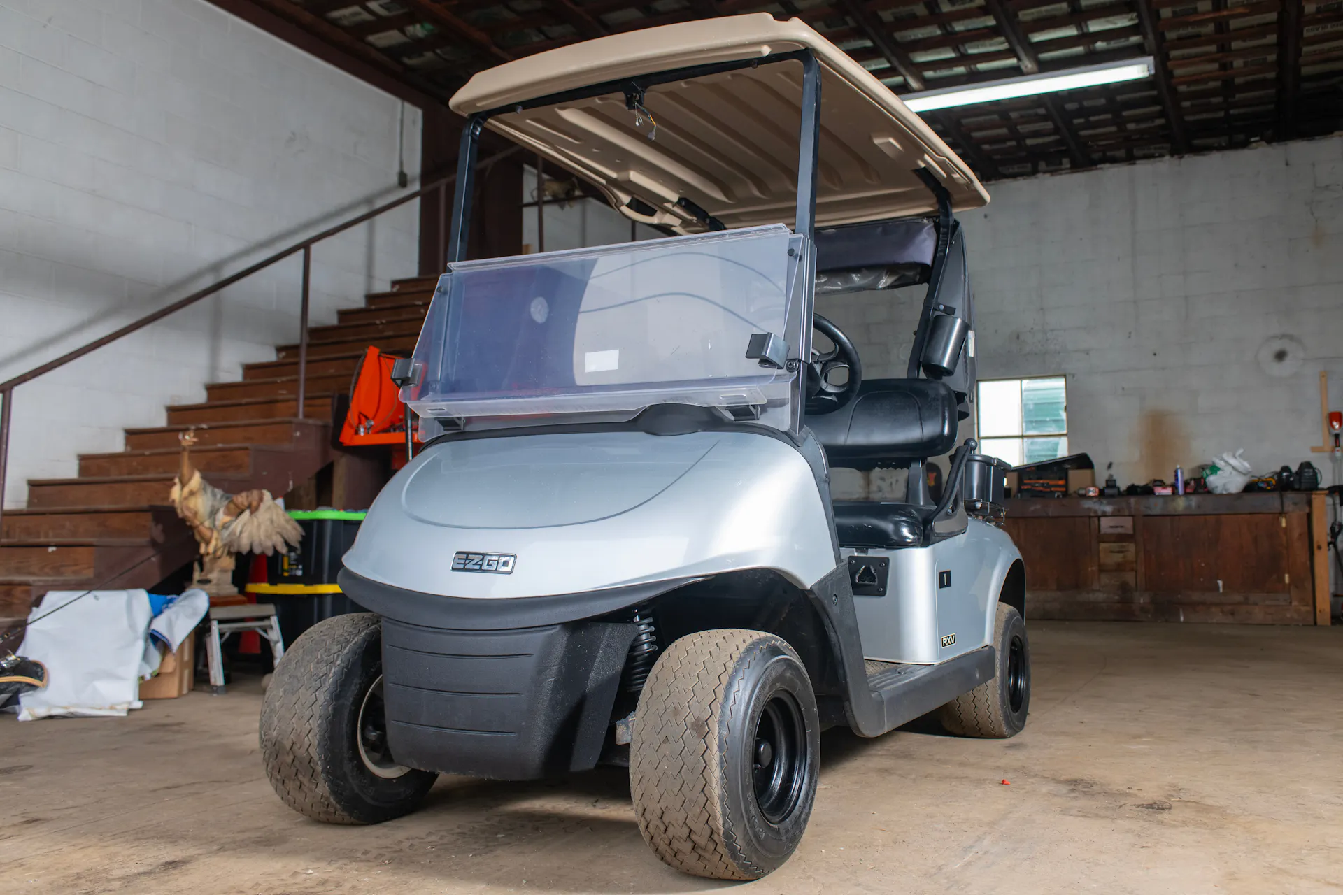 2020 E-Z-Go RXV Silver front driver 3/4 wide