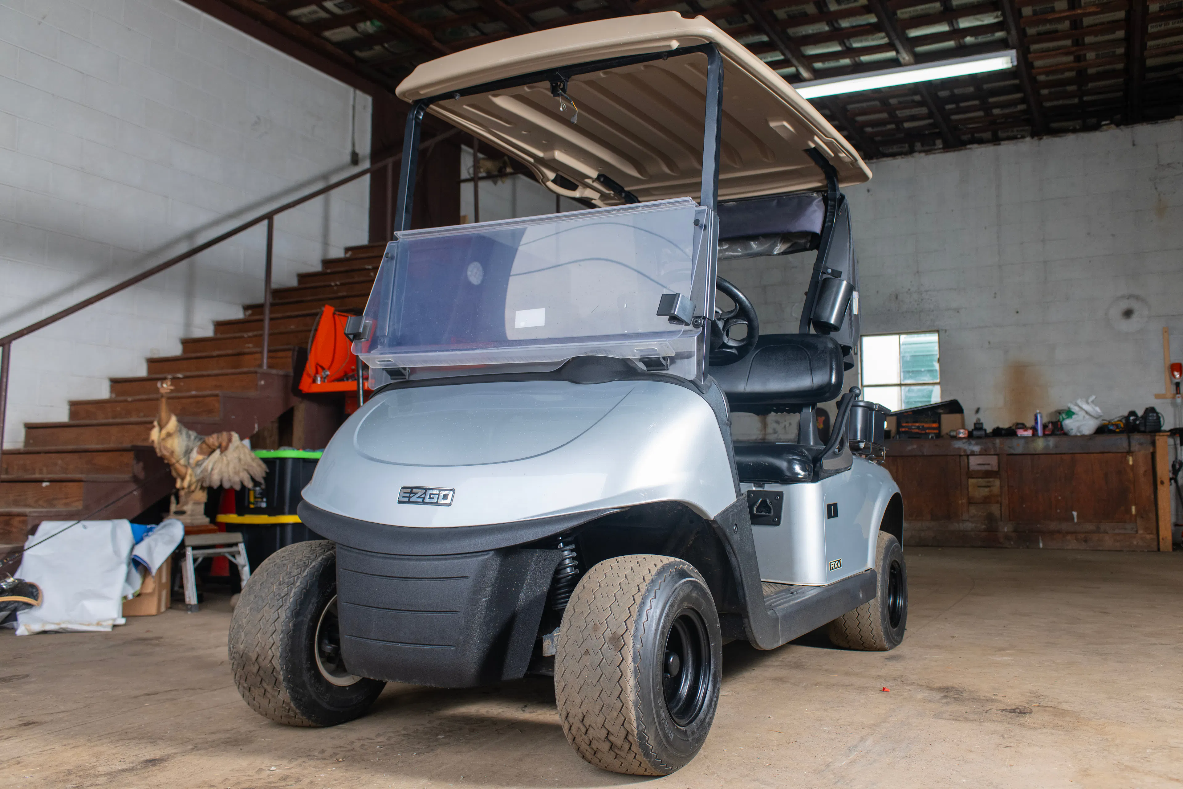 2020 E-Z-Go RXV Silver front driver 3/4 wide