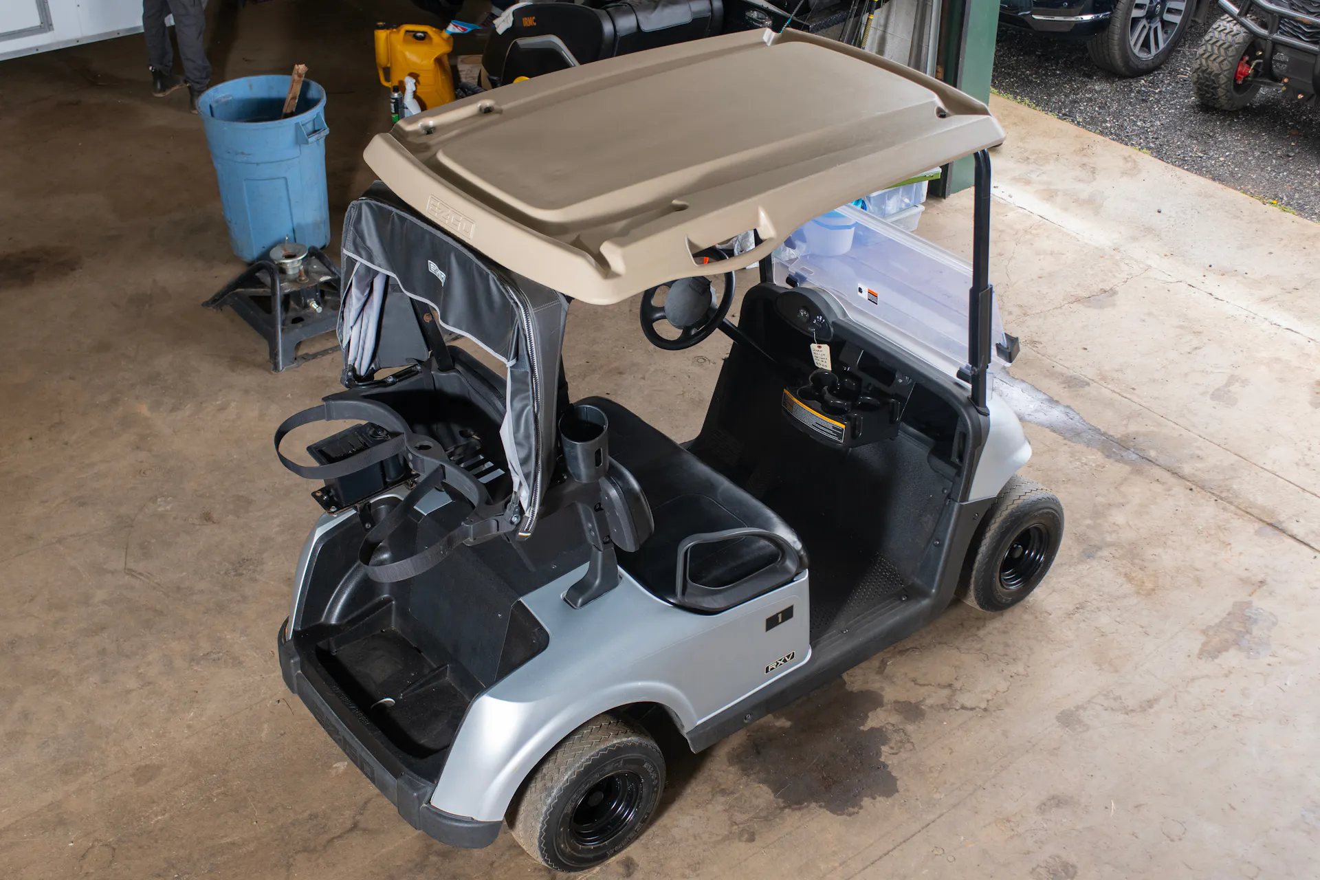 2020 E-Z-Go RXV Silver driver rear 3/4 high