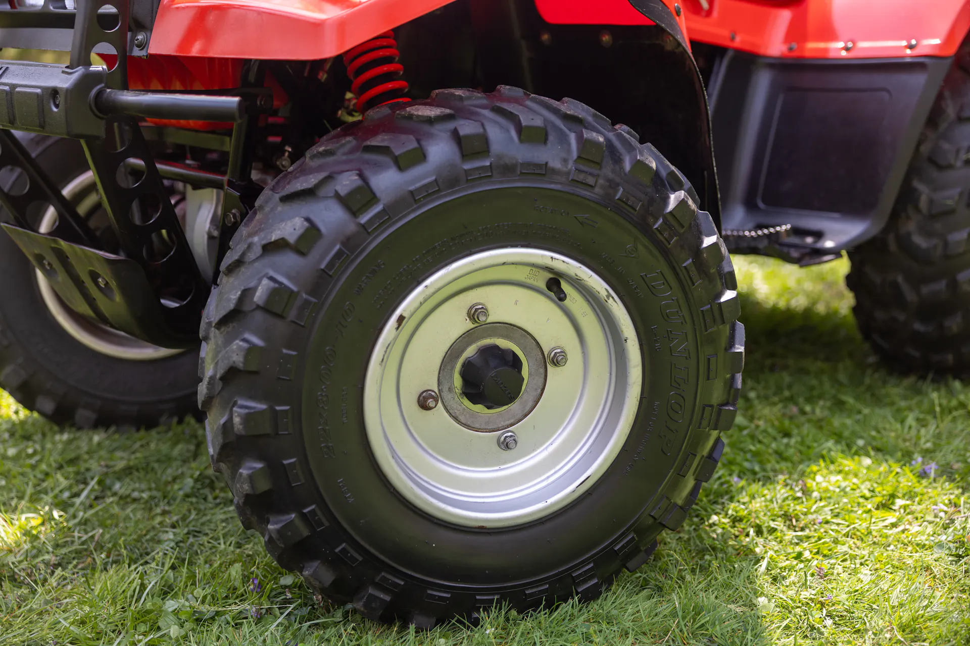 1987 Suzuki QuadRunner 250 4WD driver front wheel close