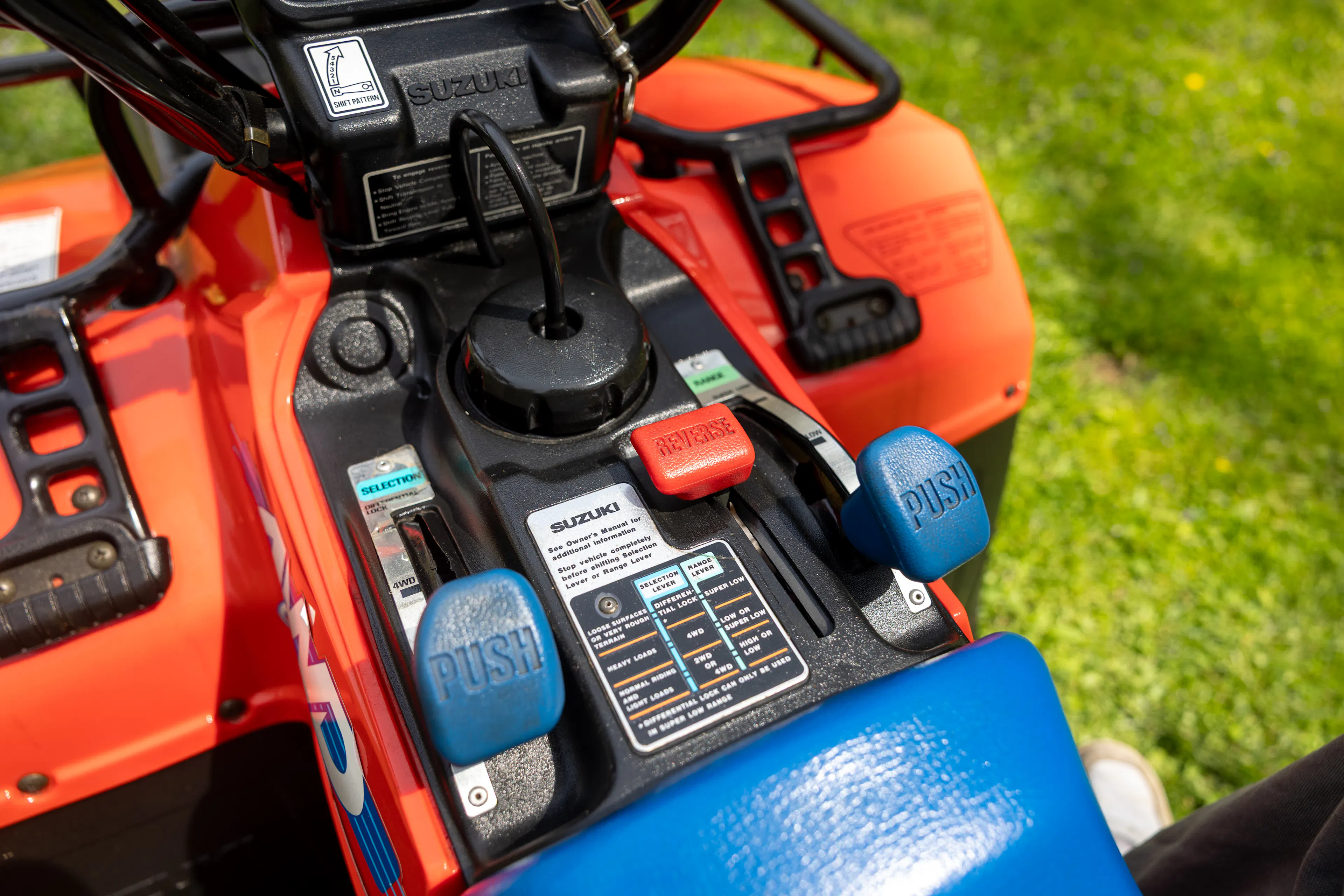 1987 Suzuki QuadRunner 250 4WD cockpit and controls close