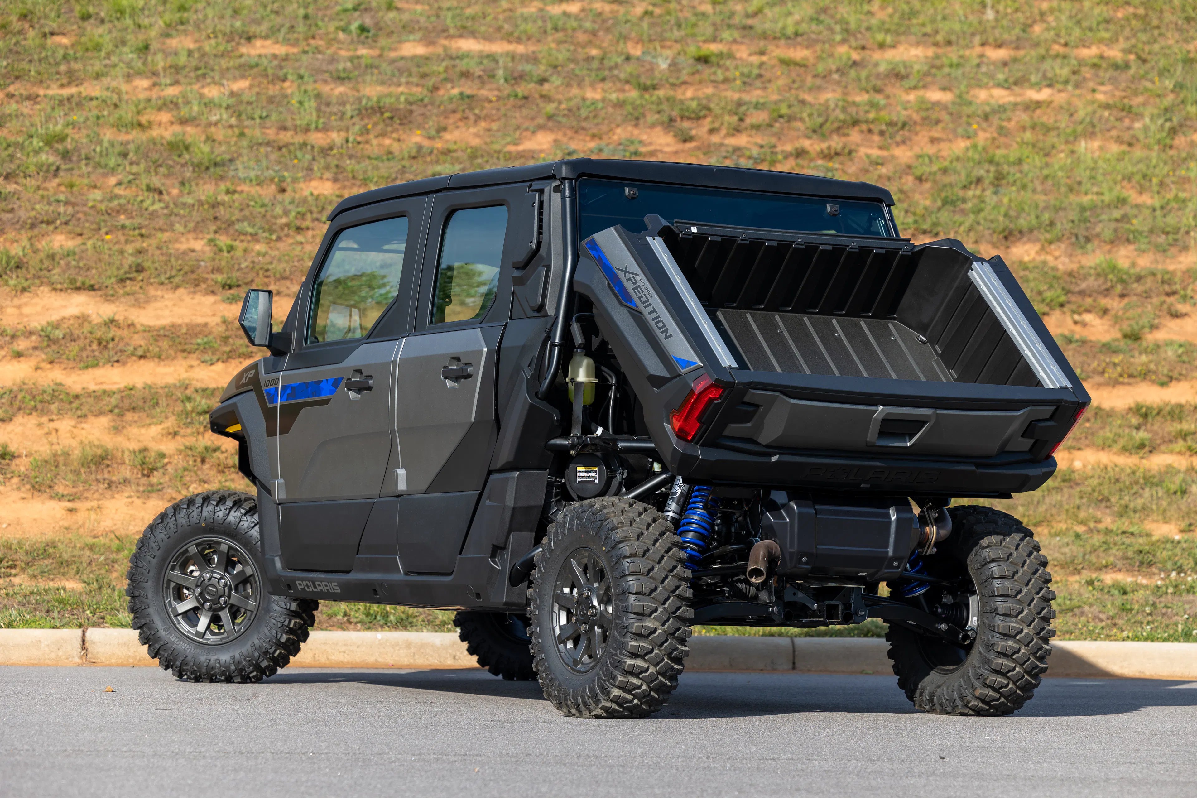 2024 Polaris Xpedition ADV 5 driver rear 3/4 steep bed up 