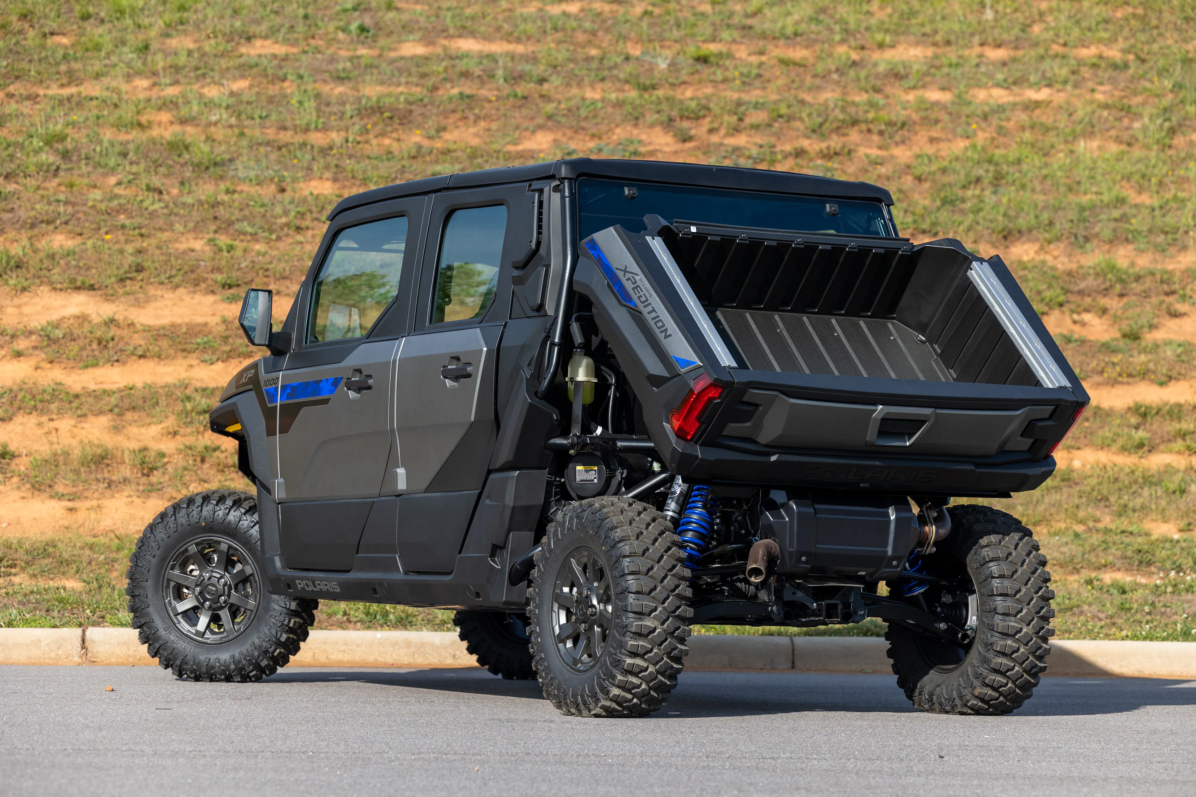 2024 Polaris Xpedition ADV 5 driver rear 3/4 steep bed up