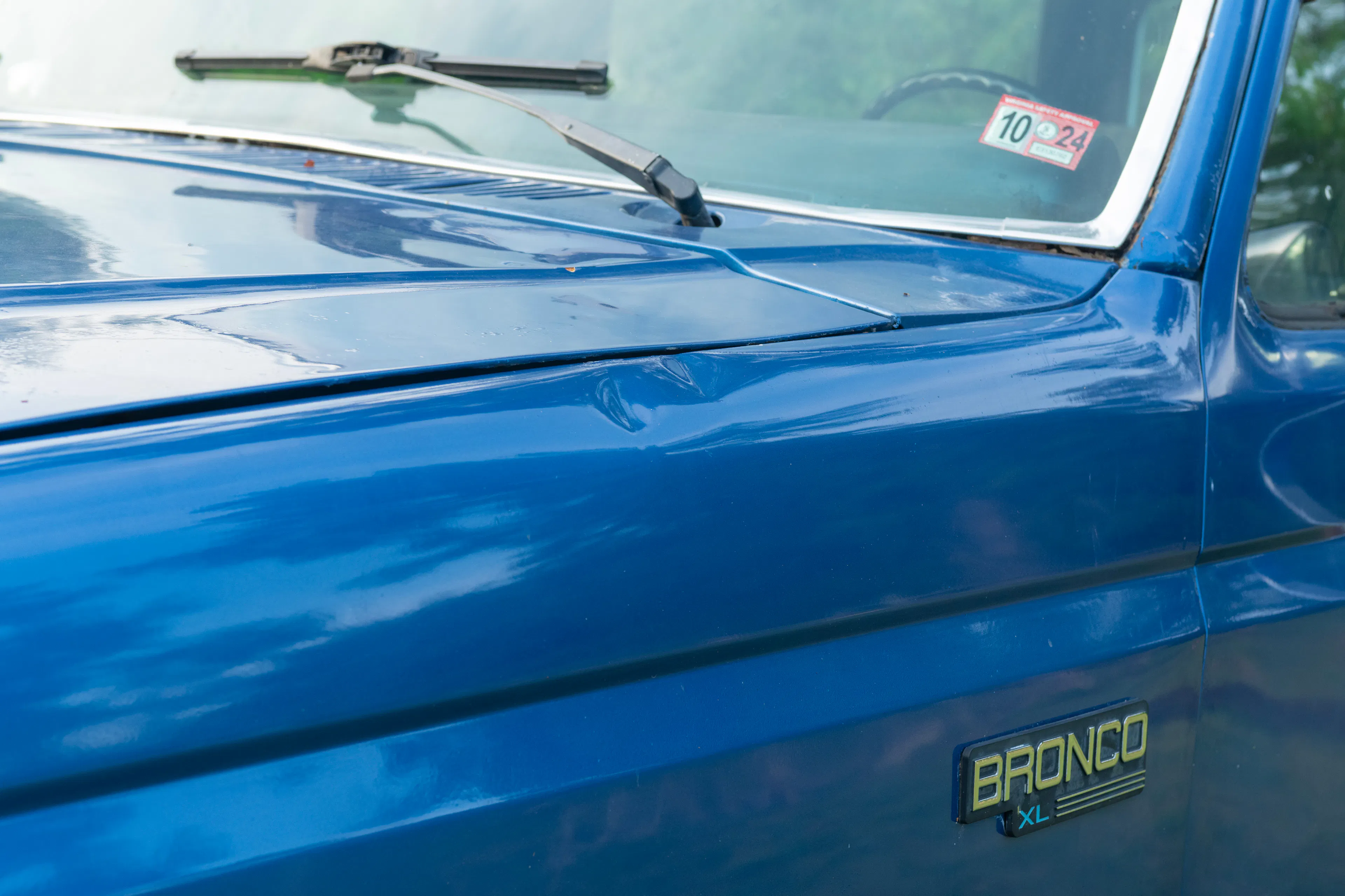1985 Ford Bronco driver fender dent detail 