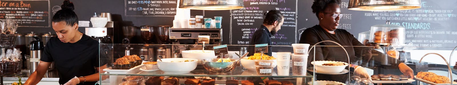 Employees at a cafe working hard