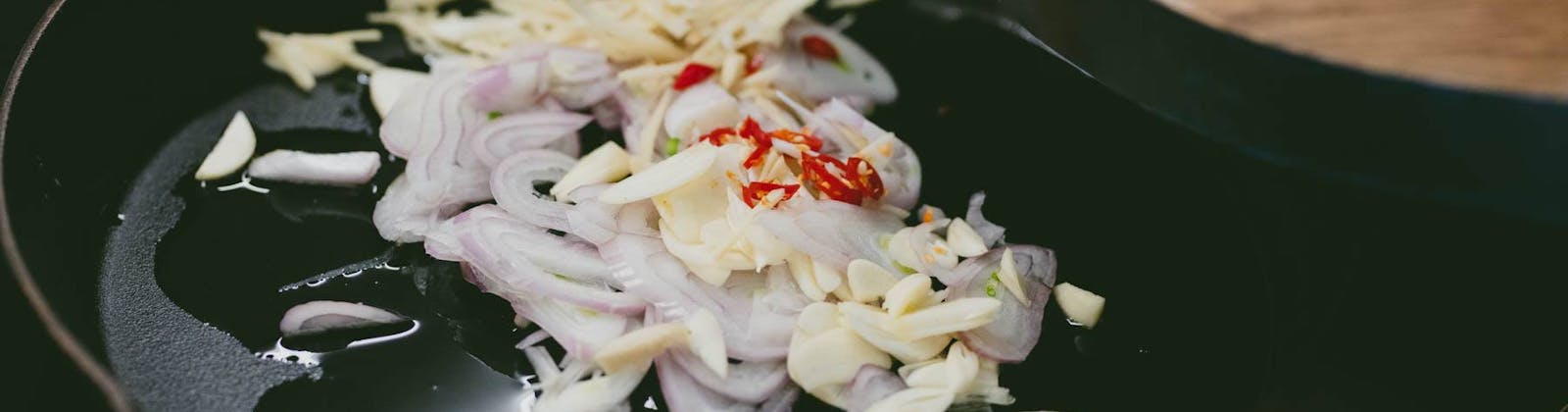 cooking onions garlic and chilli at homeland nz
