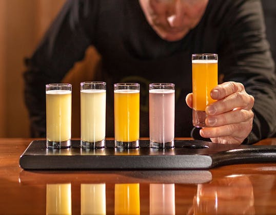 Kombucha drinks being prepared by barman 