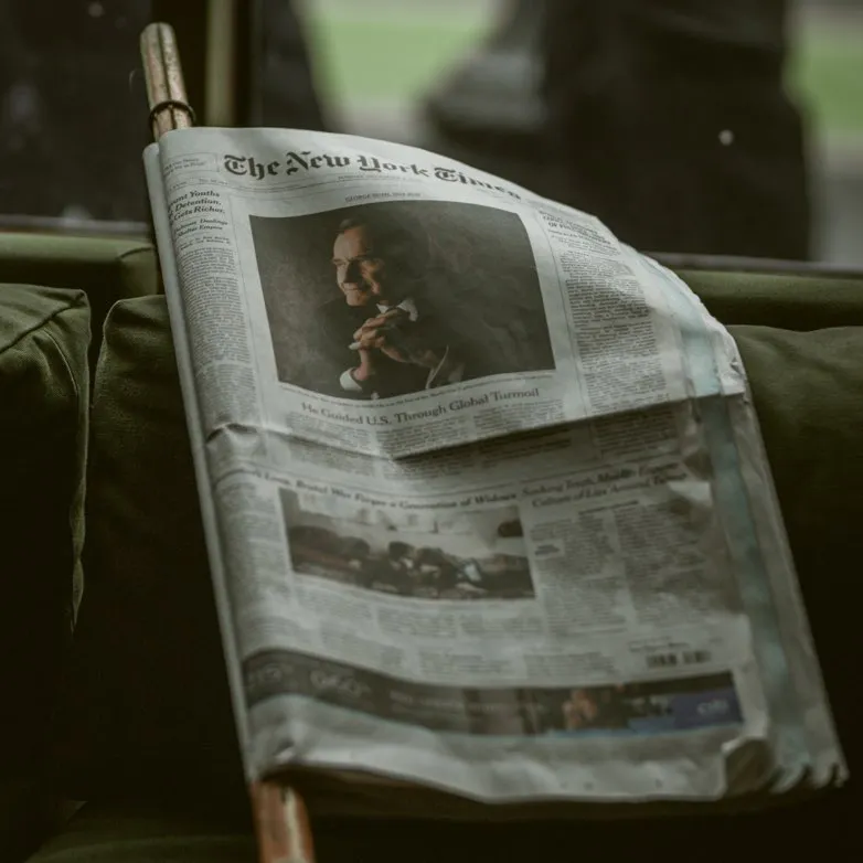 A newspaper folded over a newspaper stick.