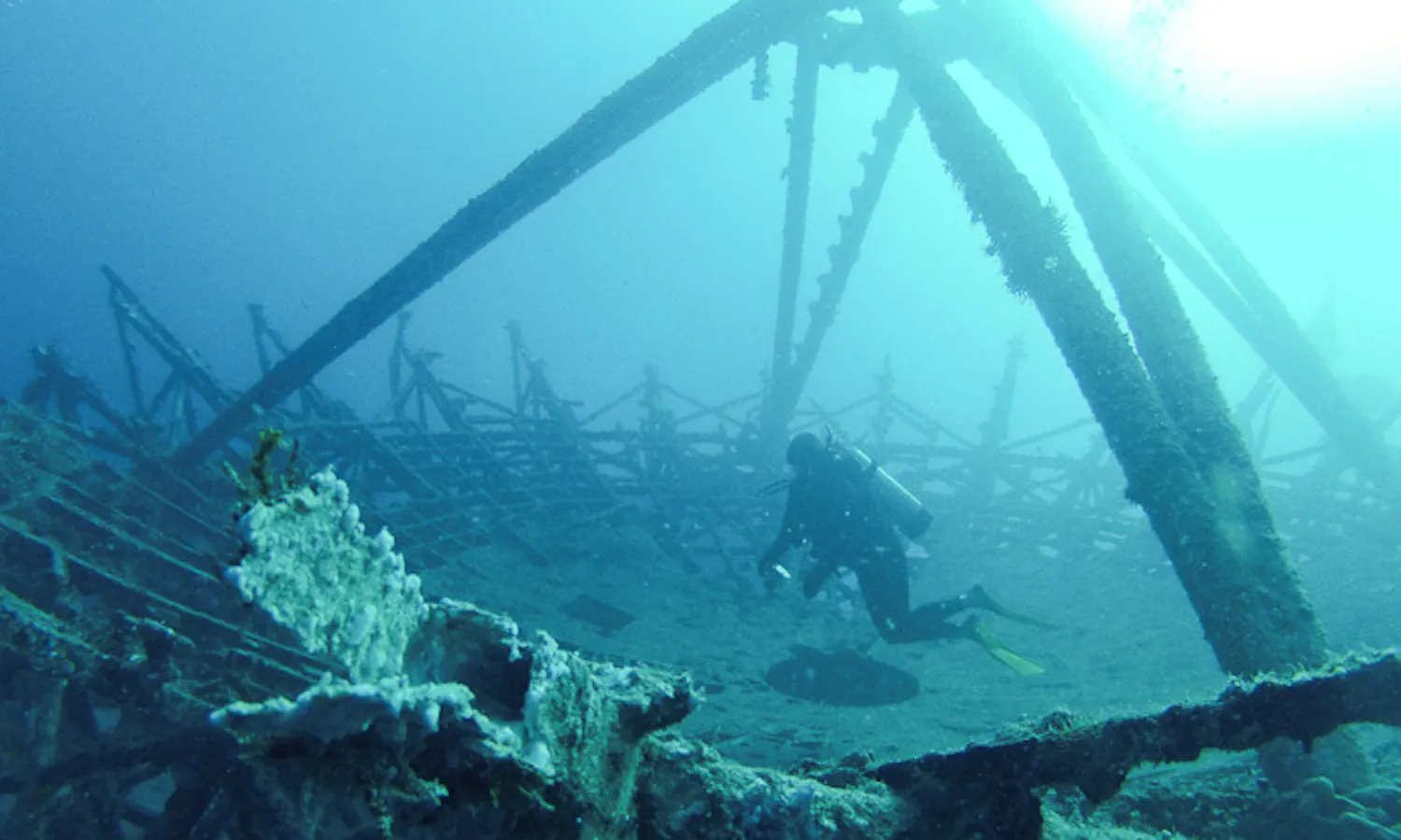 Scuba diver at an underwater wreck dive site USS Vandenberg
