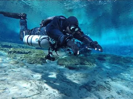 tec scuba diver in shallow waters
