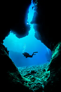 scuba diver outside of cavern