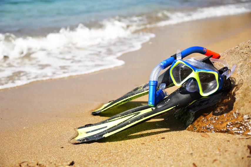 snorkel gear on the beach