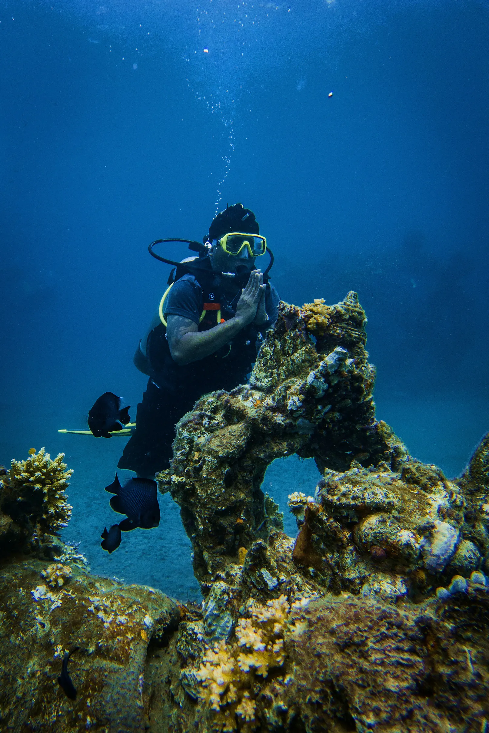 Scuba diver near coral sturctures
