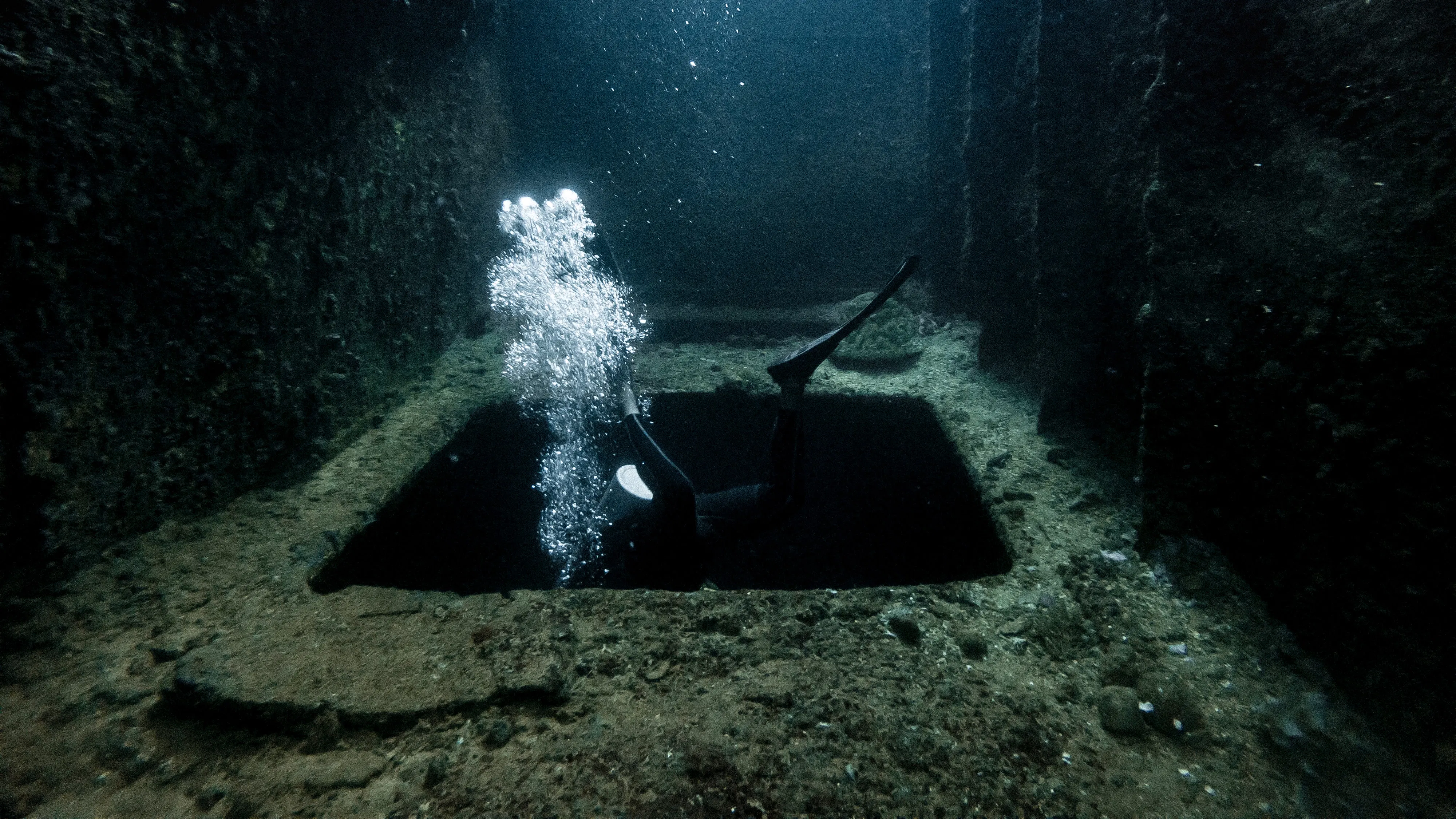 open hatch in underwater ship wreck