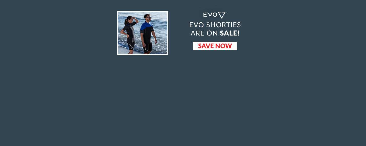 EVO shorties are on Sale. Web Banner. Male and female wearing shorty wetsuits on the beach 