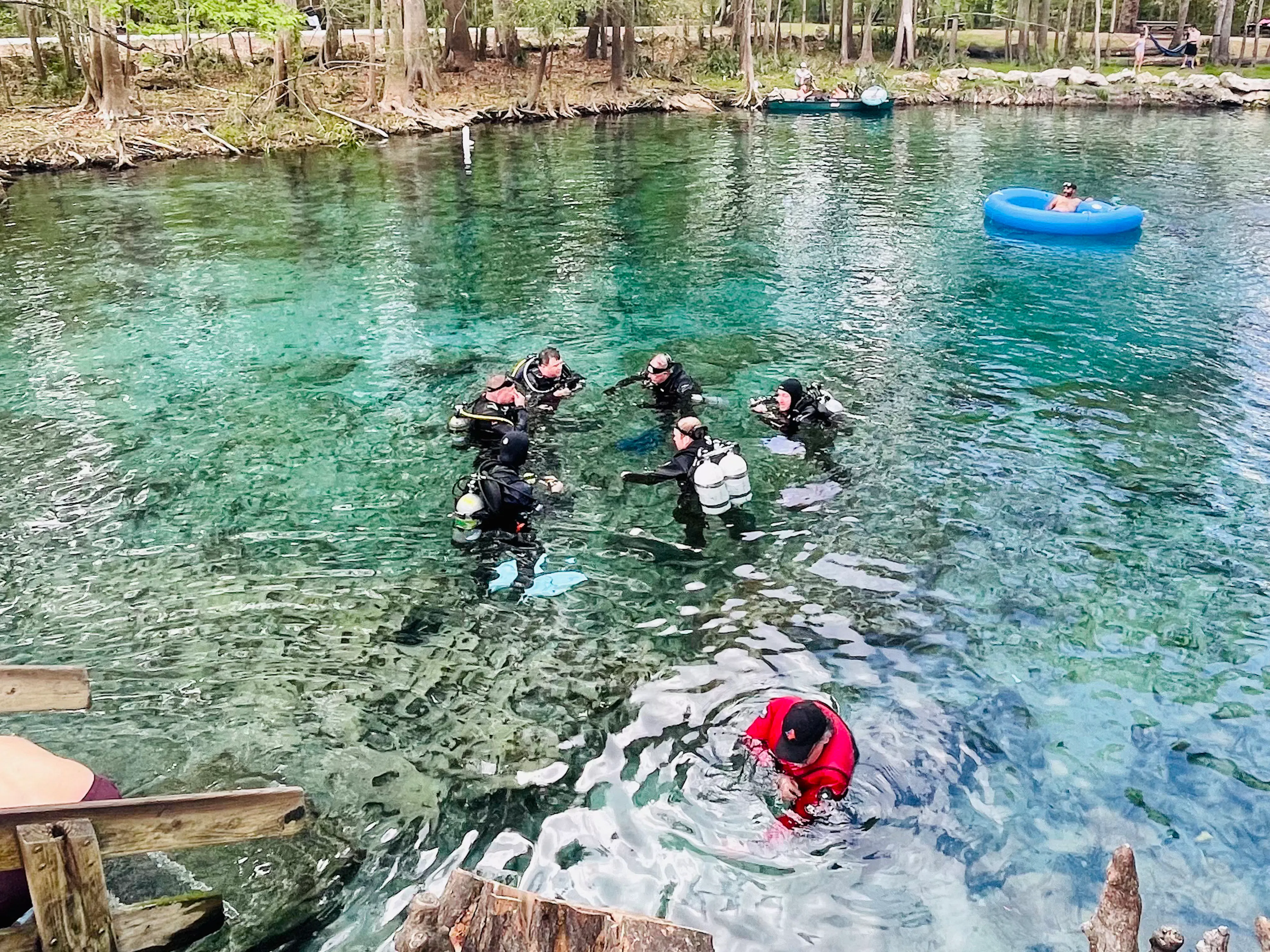 scuba divers in a spring