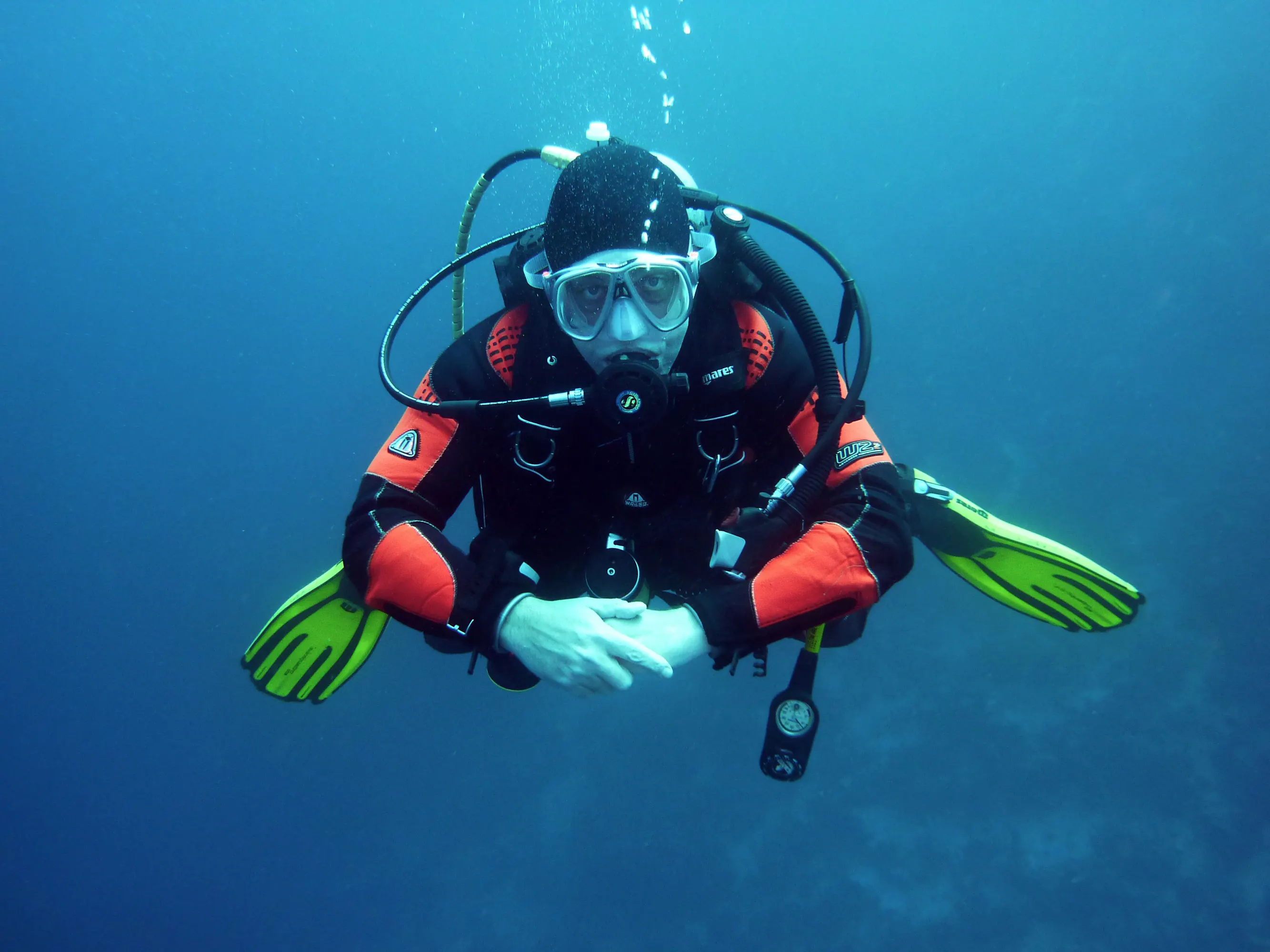 Scuba diver performing perfect buoyancy underwater.