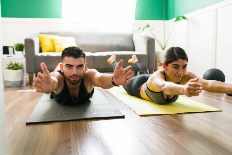 couple stretching in living room