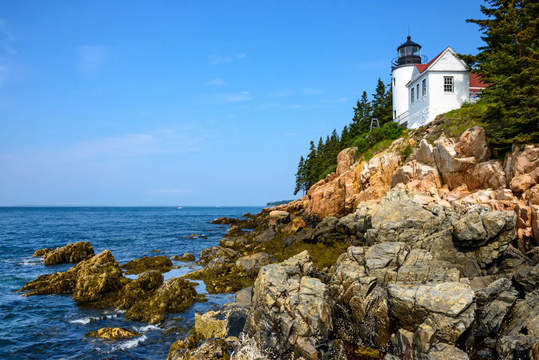 Beautiful shot of a landmark on the edge of a cliff in the distance over seeing rocks.