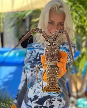 girl holding lobster