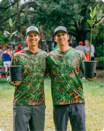Mang founders planting mangroves