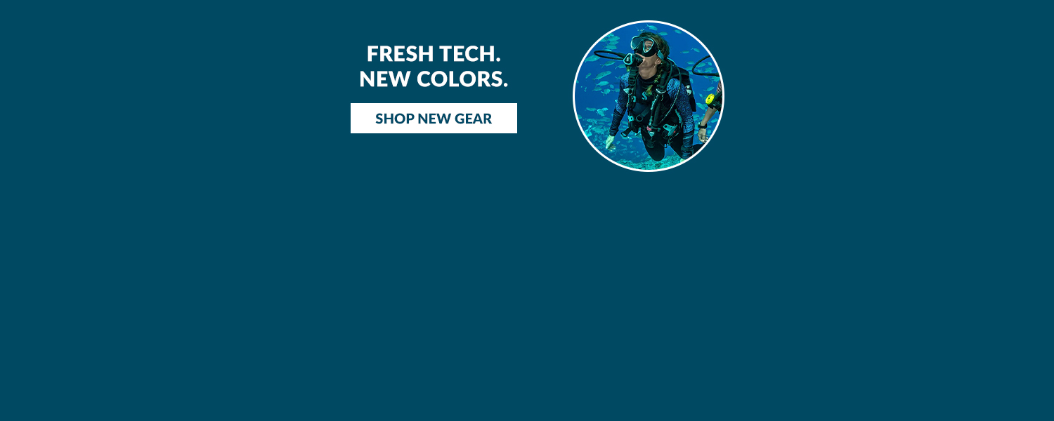 Fresh Tech. New Colors. New Product Web banner. A pair of scuba divers underwater 