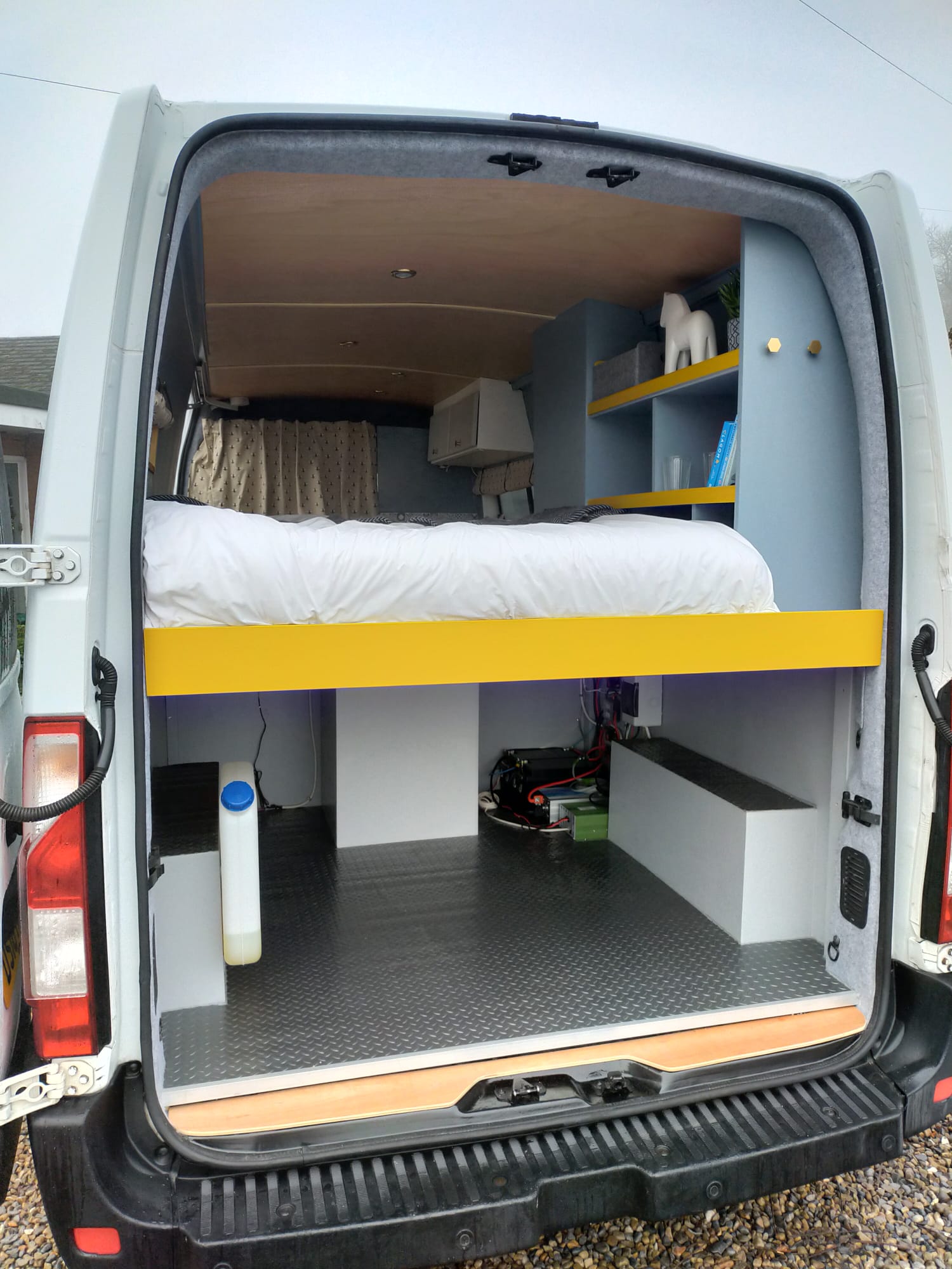 campervan garage and bed rearview