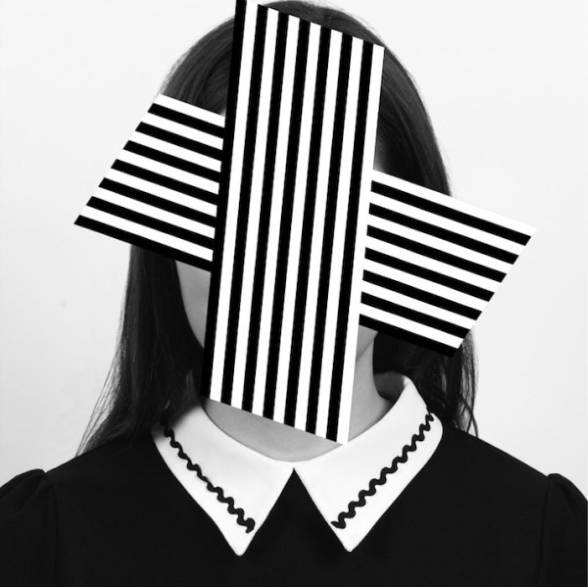 portrait with a face hidden behind graphic shapes